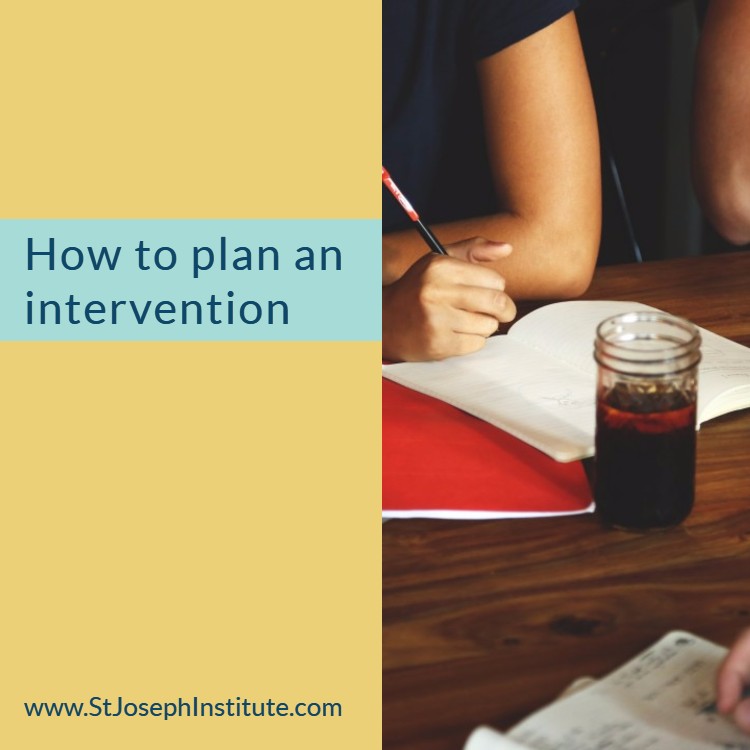 someone making notes at a desk or table - How to plan an intervention