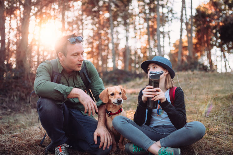 man on hike with teenage daughter and dog - talking - teens